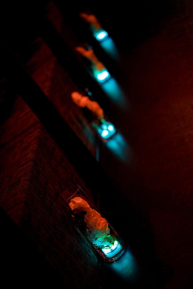 decorations in glass vase lit in a row